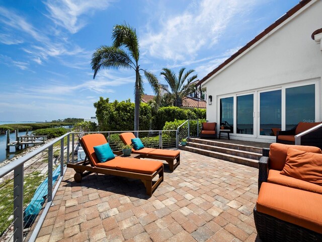 2282 Harbour Court Dr, Longboat Key, FL 34228 - view of patio / terrace featuring a water view and a balcony