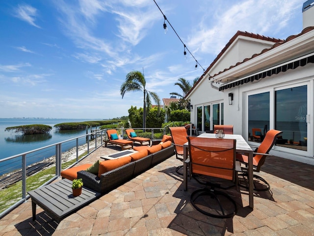2282 Harbour Court Dr, Longboat Key, FL 34228 - view of patio with a water view, outdoor lounge area, and outdoor dining space