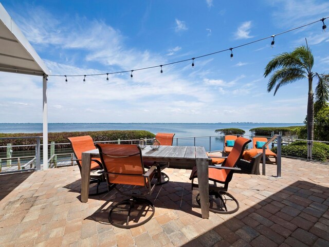 2282 Harbour Court Dr, Longboat Key, FL 34228 - view of patio / terrace featuring outdoor dining area and a water view