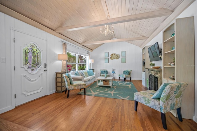 living room featuring a fireplace, a chandelier, wooden ceiling, vaulted ceiling with beams, and wood finished floors