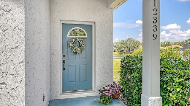 12339 Hollybush Ter, Lakewood Ranch, FL 34202 - view of exterior entry with stucco siding