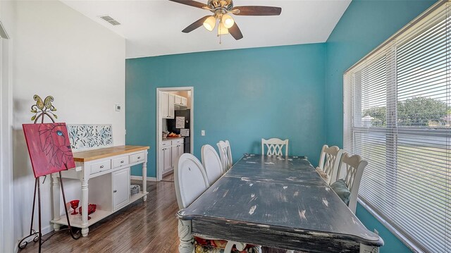 12339 Hollybush Ter, Lakewood Ranch, FL 34202 - dining area with ceiling fan, dark wood-type flooring, and baseboards