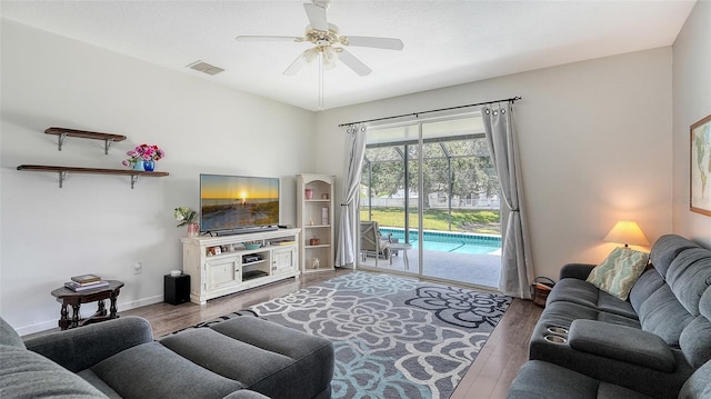 12339 Hollybush Ter, Lakewood Ranch, FL 34202 - living room featuring wood finished floors, ceiling fan, and baseboards