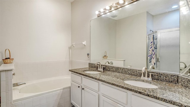 12339 Hollybush Ter, Lakewood Ranch, FL 34202 - full bathroom with a shower stall, a garden tub, and double vanity