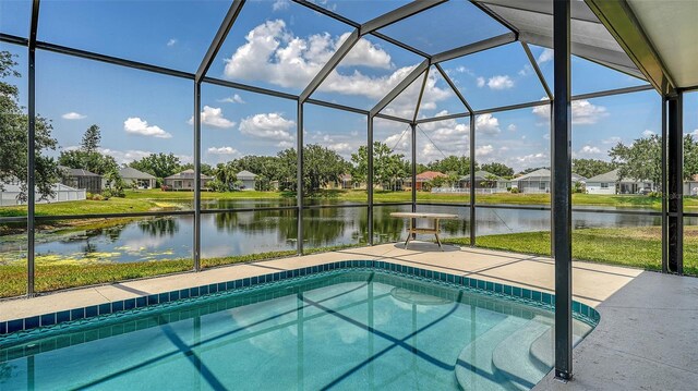 12339 Hollybush Ter, Lakewood Ranch, FL 34202 - outdoor pool featuring a water view, a residential view, a patio area, and glass enclosure