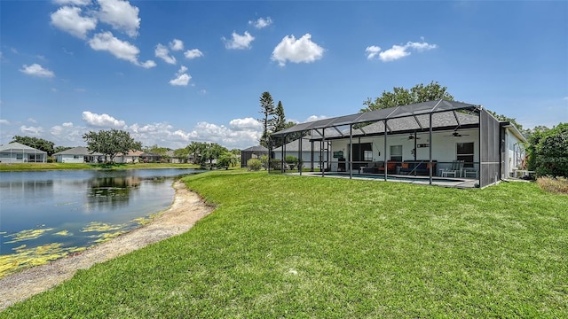 12339 Hollybush Ter, Lakewood Ranch, FL 34202 - rear view of house with a ceiling fan, a water view, a lawn, an outdoor pool, and a patio area