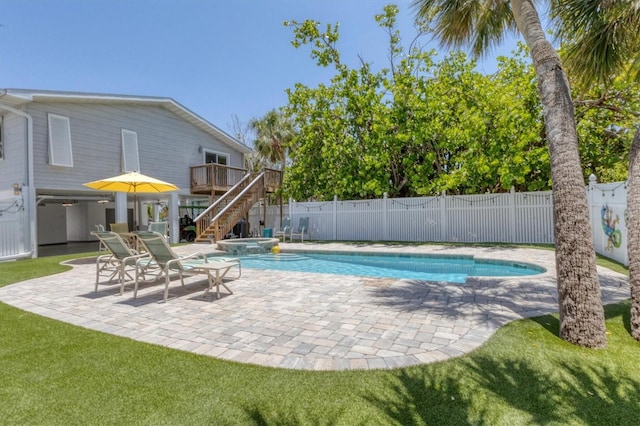 view of pool featuring a patio, a fenced backyard, stairway, and a deck