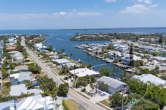 birds eye view of property featuring a water view and a residential view