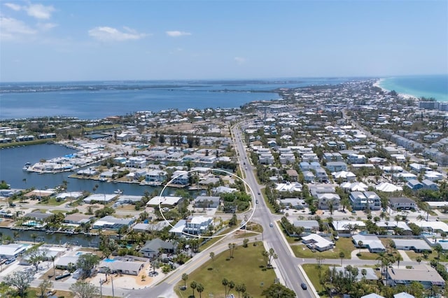 drone / aerial view featuring a residential view and a water view