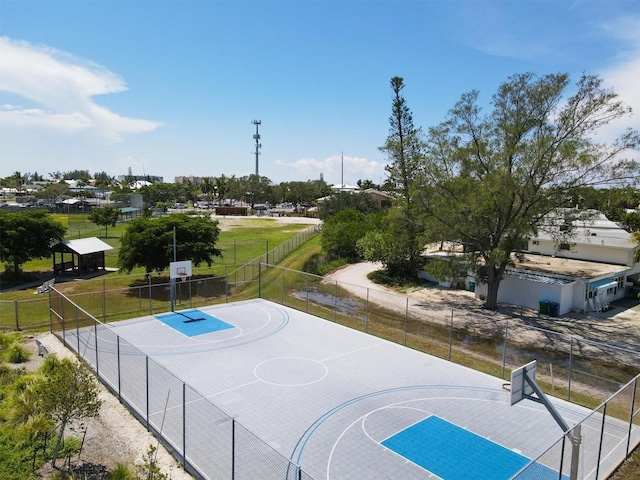 view of basketball court featuring community basketball court and fence