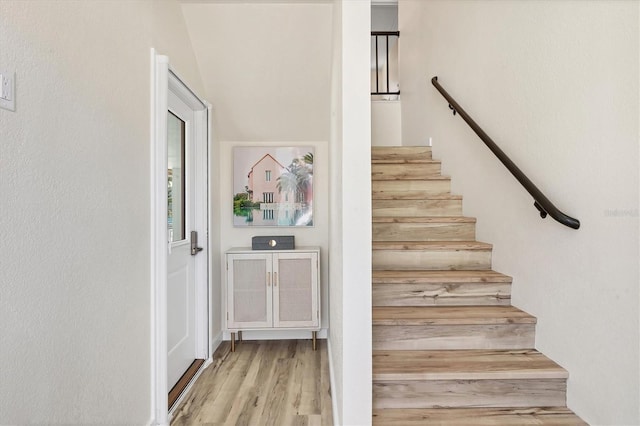 501 Key Royale Dr, Holmes Beach, FL 34217 - stairs featuring wood finished floors