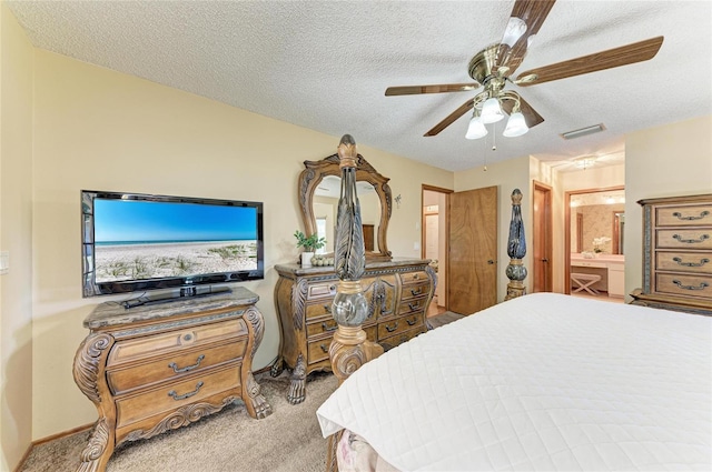 bedroom featuring carpet floors, a ceiling fan, a textured ceiling, and visible vents