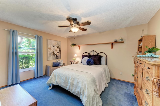 bedroom featuring baseboards, carpet, and a textured ceiling