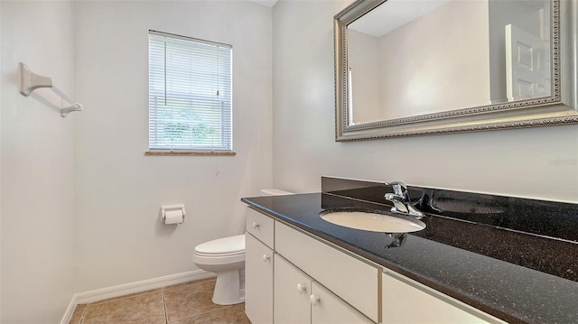 4264 Central Sarasota Pkwy Unit 111, Sarasota, FL 34238 - half bath with baseboards, tile patterned floors, toilet, and vanity