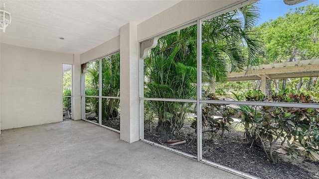 4264 Central Sarasota Pkwy Unit 111, Sarasota, FL 34238 - unfurnished sunroom with concrete flooring