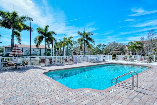 4264 Central Sarasota Pkwy Unit 111, Sarasota, FL 34238 - community pool featuring a patio and fence