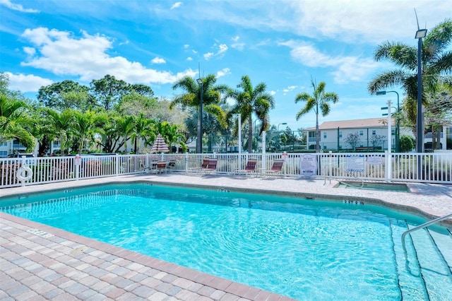 4264 Central Sarasota Pkwy Unit 111, Sarasota, FL 34238 - community pool with fence and a patio area