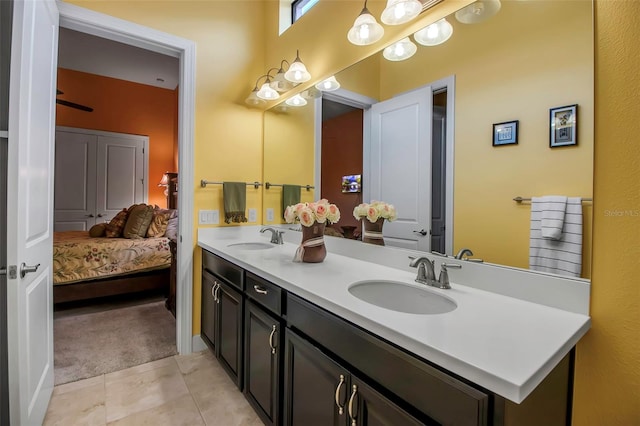 full bathroom featuring double vanity and tile patterned flooring