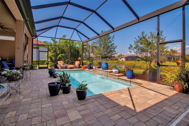 view of pool with a patio and a lanai