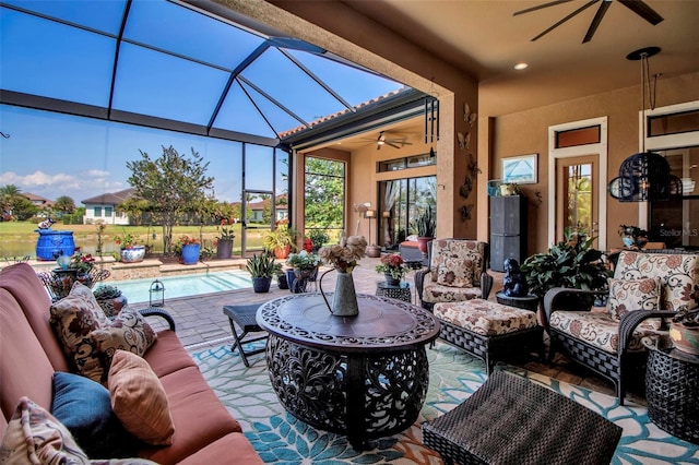 view of patio / terrace with ceiling fan, an outdoor hangout area, an outdoor pool, and a lanai