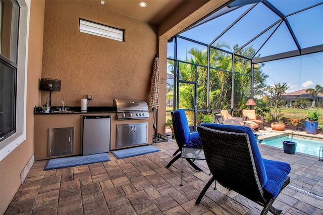 view of patio / terrace with a grill, exterior kitchen, an outdoor pool, glass enclosure, and a sink