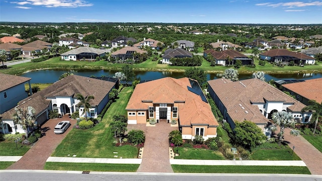 aerial view of residential area with a large body of water