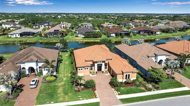 aerial perspective of suburban area featuring a nearby body of water
