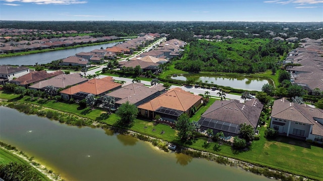 aerial overview of property's location with nearby suburban area and a large body of water