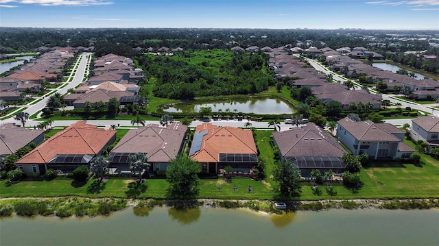 aerial view of residential area featuring a nearby body of water