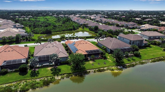 aerial view of residential area featuring a nearby body of water