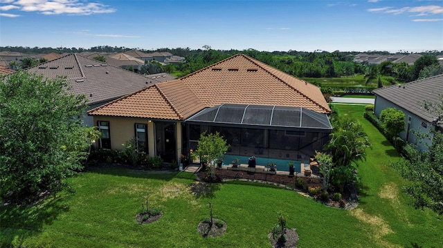 view of front of house with a tiled roof, an outdoor pool, a front yard, a patio area, and a residential view