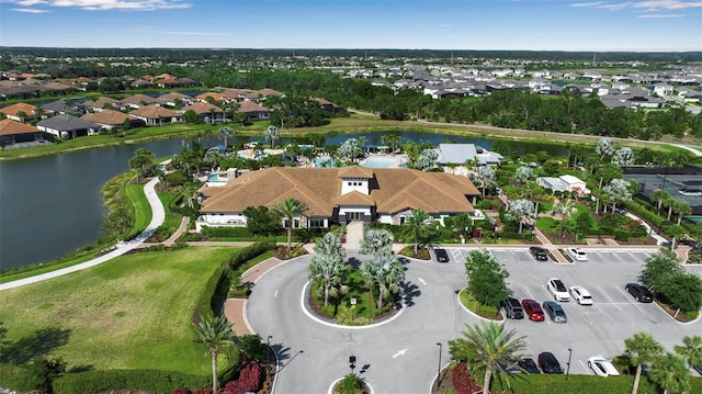 aerial perspective of suburban area with a large body of water