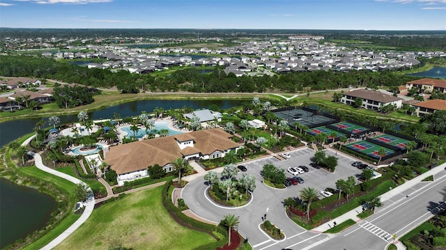 aerial overview of property's location featuring a large body of water and nearby suburban area