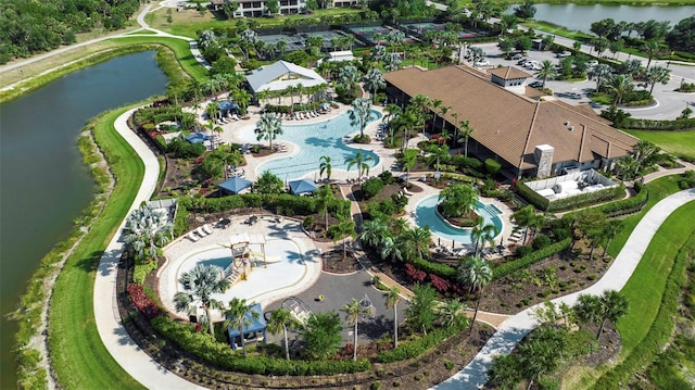 aerial view of a pool and a nearby body of water