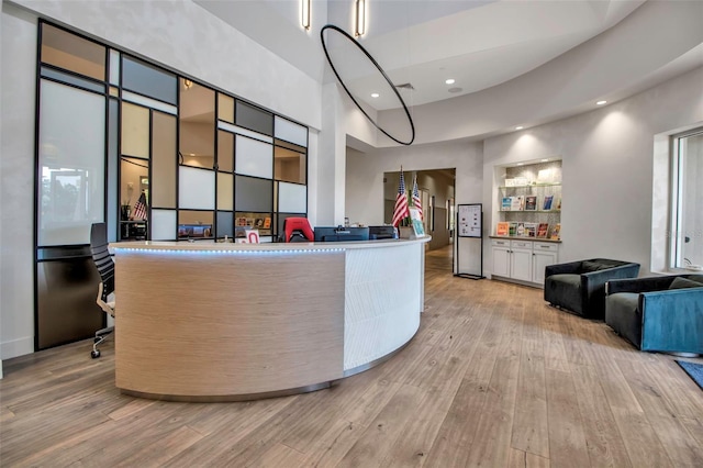 welcome area featuring recessed lighting and a high ceiling