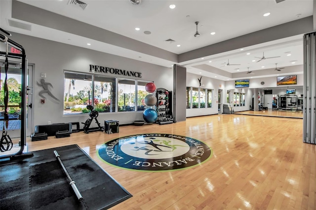 workout area featuring wood finished floors, recessed lighting, and ceiling fan