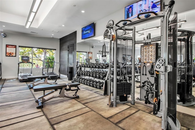 exercise room with recessed lighting and baseboards