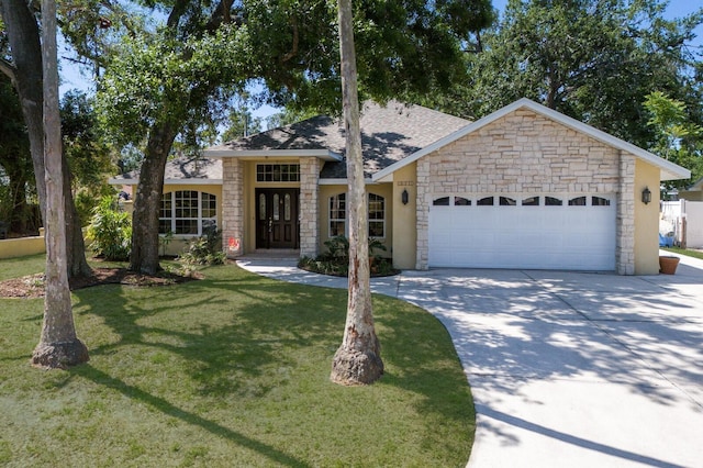 3209 2nd Ave W, Bradenton, FL 34205 - ranch-style home with driveway, stone siding, a front yard, an attached garage, and french doors