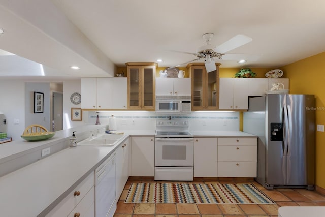 3209 2nd Ave W, Bradenton, FL 34205 - kitchen featuring light countertops, recessed lighting, and white appliances