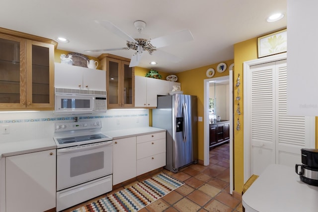 3209 2nd Ave W, Bradenton, FL 34205 - kitchen featuring light countertops, a ceiling fan, tasteful backsplash, and white appliances