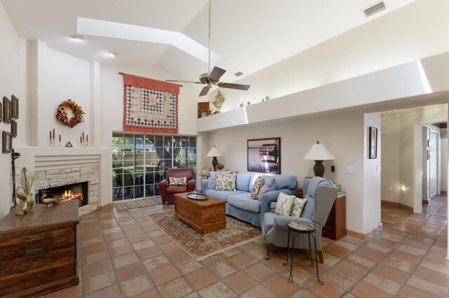 3209 2nd Ave W, Bradenton, FL 34205 - living room with visible vents, ceiling fan, baseboards, high vaulted ceiling, and a stone fireplace