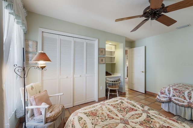3209 2nd Ave W, Bradenton, FL 34205 - tiled bedroom with baseboards, visible vents, ceiling fan, and a closet