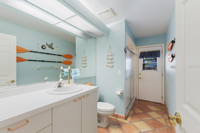 3209 2nd Ave W, Bradenton, FL 34205 - full bathroom featuring tile patterned floors, a shower stall, toilet, vanity, and visible vents