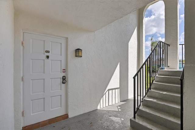 5800 Hollywood Blvd Unit 312, Sarasota, FL 34231 - view of exterior entry with stucco siding and a balcony