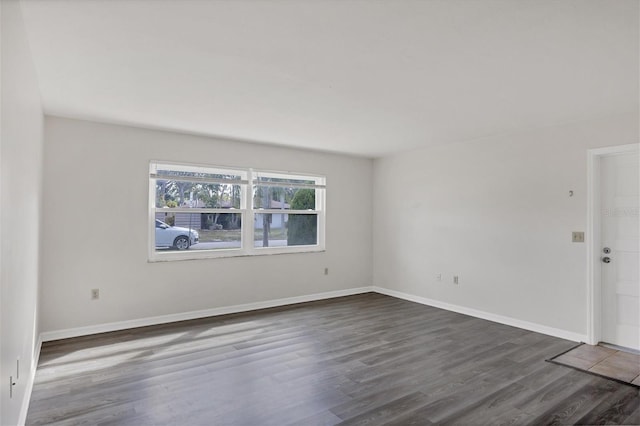 5800 Hollywood Blvd Unit 312, Sarasota, FL 34231 - empty room with baseboards and wood finished floors