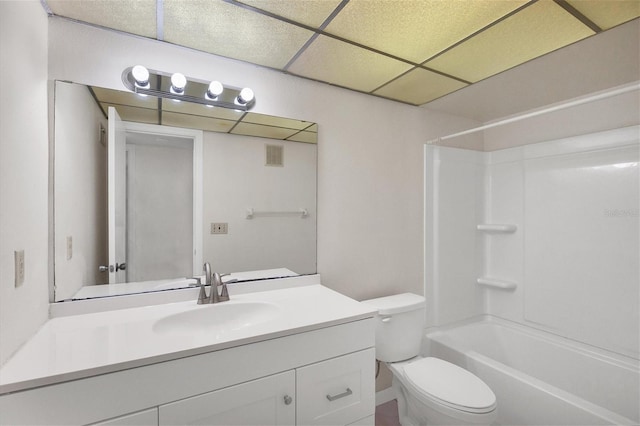 5800 Hollywood Blvd Unit 312, Sarasota, FL 34231 - bathroom featuring toilet, a drop ceiling, visible vents, vanity, and shower / bathtub combination