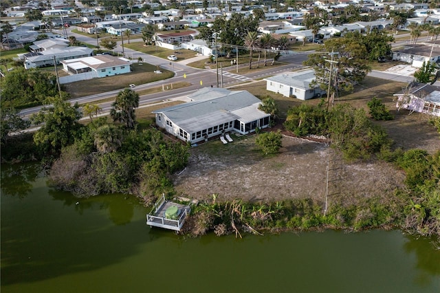 drone / aerial view featuring a residential view and a water view