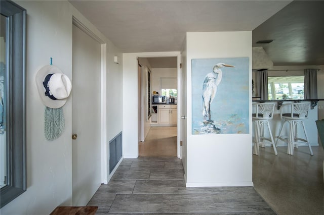 hall featuring visible vents