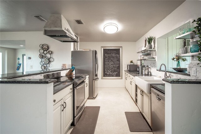 kitchen featuring open shelves, a sink, appliances with stainless steel finishes, visible vents, and range hood