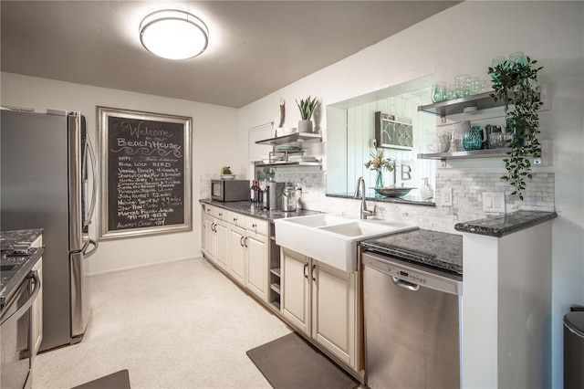 kitchen with backsplash, a sink, open shelves, and stainless steel appliances